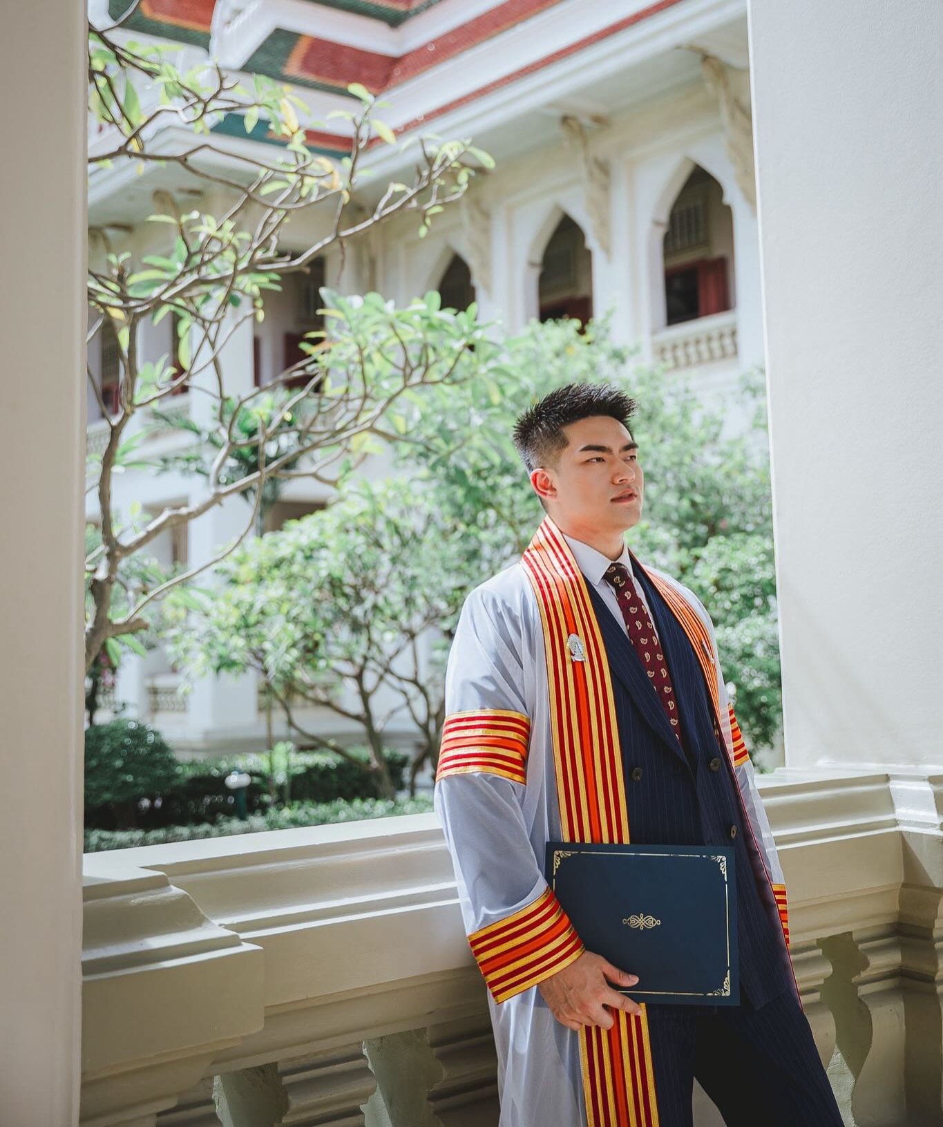Dr. Chi Che on a balcony at Chulalongkorn University